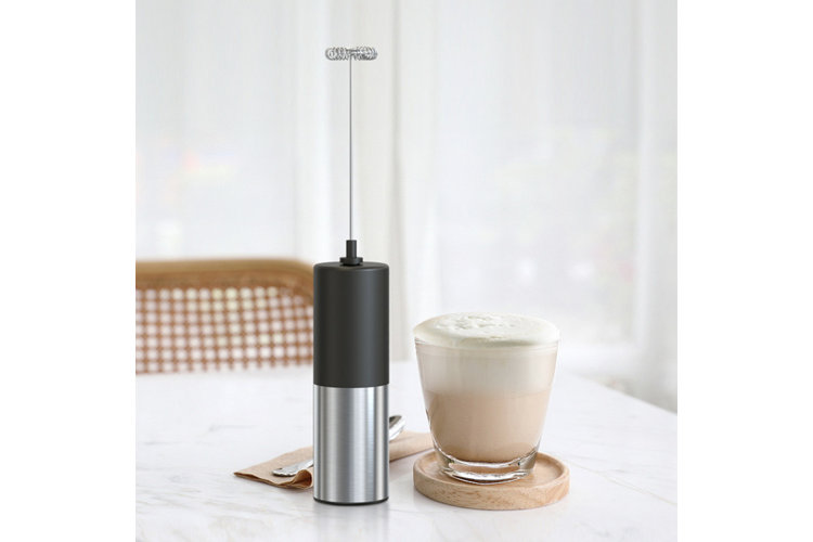 coffee in mug with milk frother