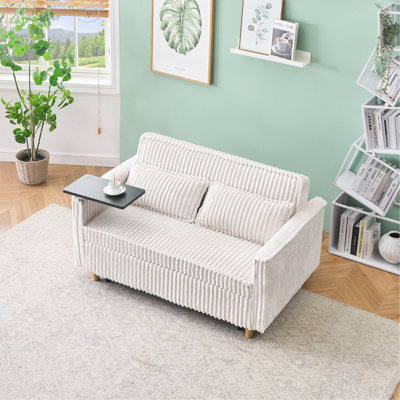 Le canapé escamotable en velours côtelé beige avec fonctions doubles