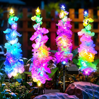 Décorations de jardin solaires à énergie solaire, paquet de 4 lumières DEL Deliumium à changement de couleur RVB améliorées, 36 lumières à DEL colorées et imperméables à énergie solaire pour les allées de pelouse