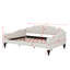 A Full-Size Upholstered Daybed With Tufted Detailing