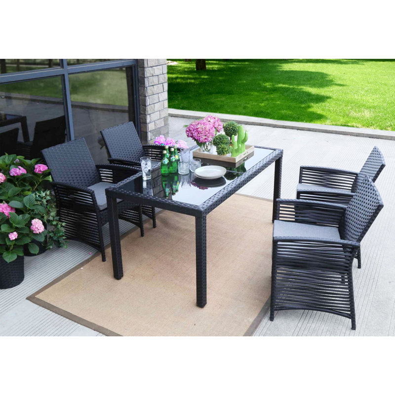 Clyde 4 - Person Patio Dining Set with Rectangular Table , Cushions Included, Black