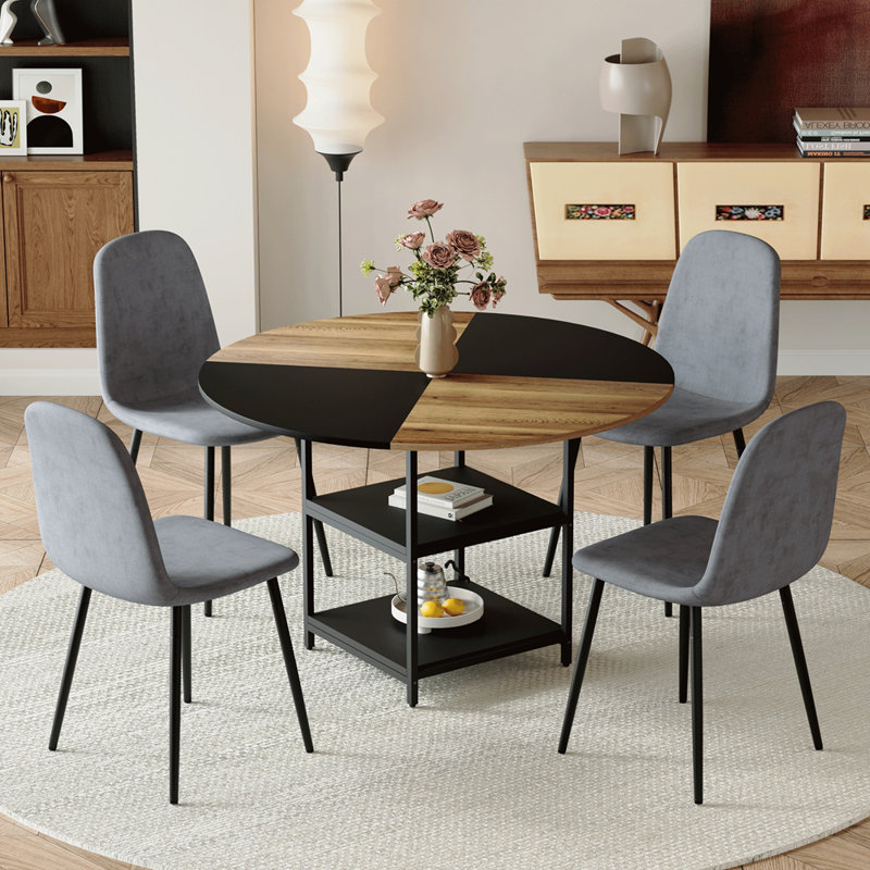 Ensemble de table et de chaises. Une table de salle à manger circulaire épissée de couleur moderne de 47,3 pouces de diamètre - double couche de rangement. Assorti de 4 chaises en tissu de lin gris foncé. Pieds de chaise de pulvérisation en fer