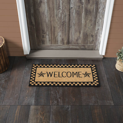 Tapis noir Welcome