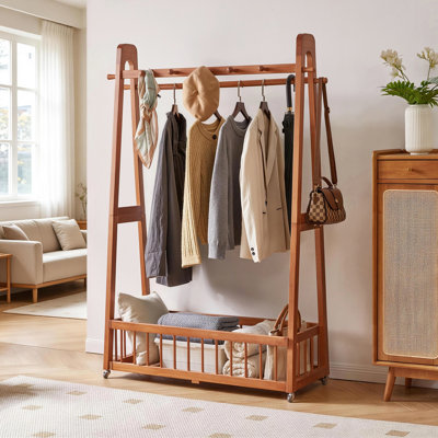 Solid Pine Garment Rack with Locking Casters and Spacious Storage Basket - Classic Cherry-Finished Clothing Stand for Bedroom, Entryway, or Closet