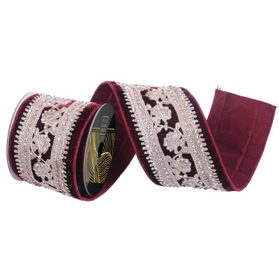 4" x 5yd Burgundy Velvet Wired Ribbon with Champagne Jeweled Center. Gold Metallic Backing. Measuring 4 inches in width and 5 yards in length, it's perfect for a variety of festive projects.