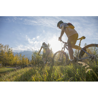 Mountain Biker Rides in Autumn by Ascentxmedia