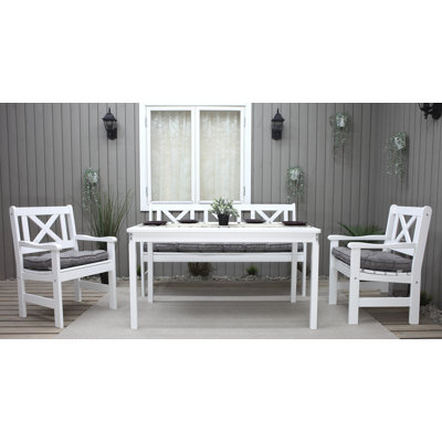 Destry 5 - Person Solid Wood Patio Dining Set Rectangular Table with Cushions Included