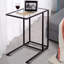 Table basse d'appoint avec plateau en verre et canapé