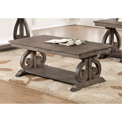 Table de placage traditionnelle avec finition chêne foncé et base à volutes