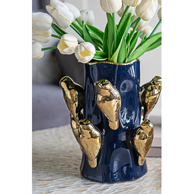 Vase en céramique avec branches d'or