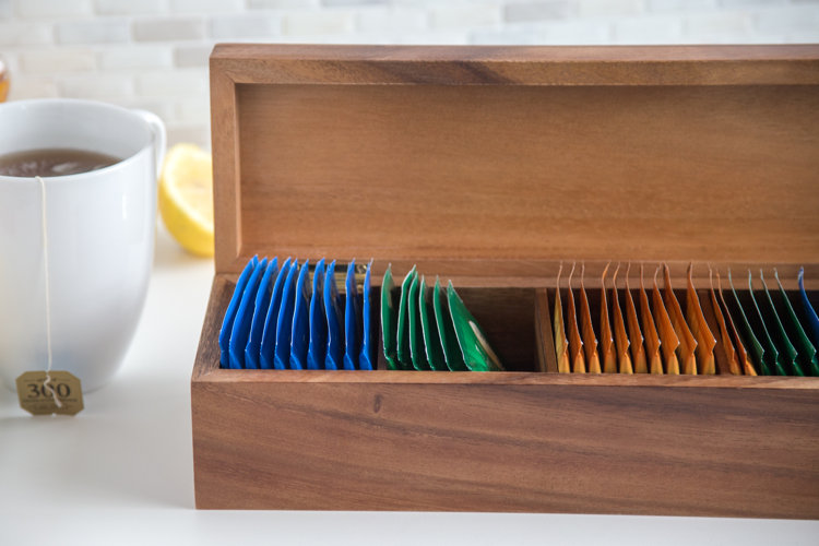 closeup of a wood teabox with multicolor tea bags organized within