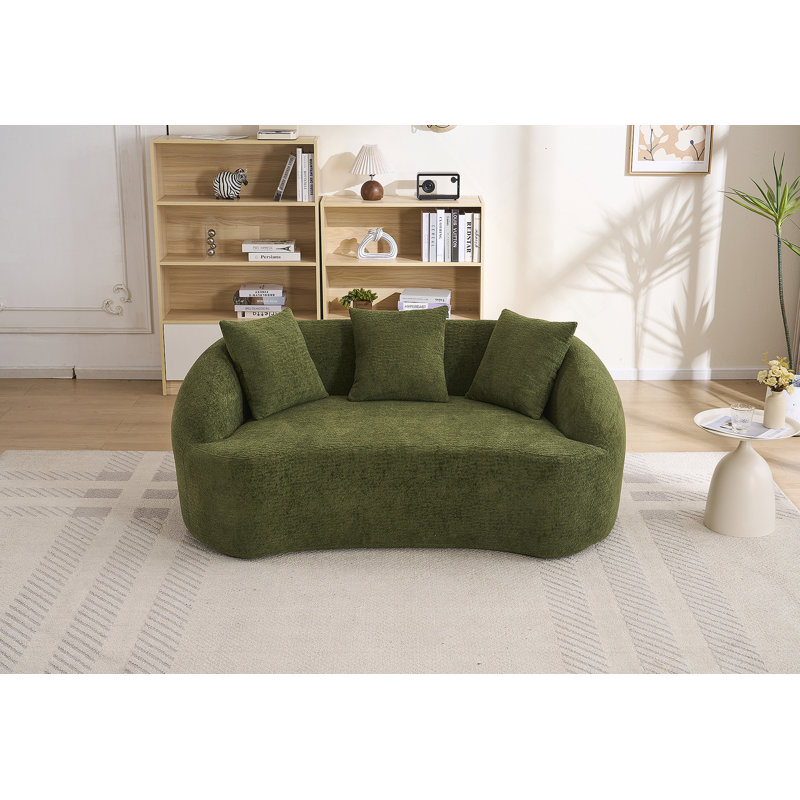 Canapé incurvé moderne sans dossier avec dossier amélioré et revêtement en chenille pour une assise confortable dans des espaces compacts.