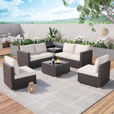 Ensemble de conversation d'extérieur en osier 8 pièces avec coussins, boîte de rangement et table basse en verre trempé pour le jardin, le porche ou la cour