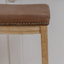 Tabouret en bois massif avec siège rembourré Bartonville-875261410-929350068