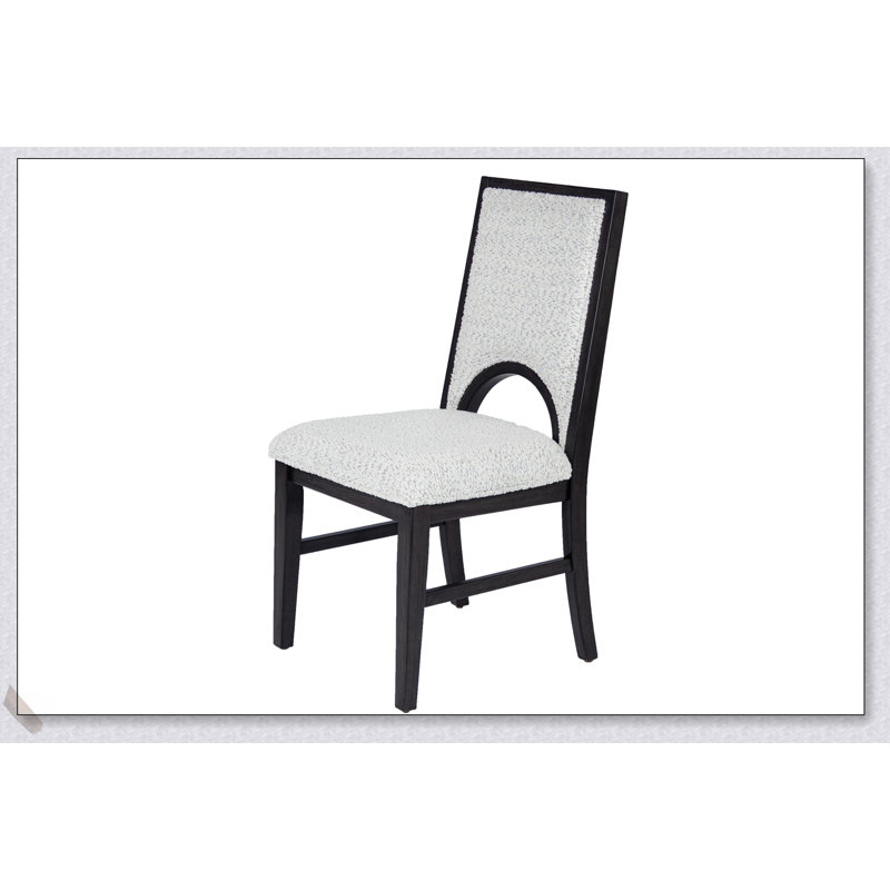 Table de salle à manger ronde moderne blanche avec base conique et 4 chaises découpées en tissu noir, parfaite pour les espaces compacts.