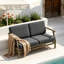 Causeuse d'extérieur en bois de teck avec coussin et accoudoirs Clinkscales-114983538-114983539