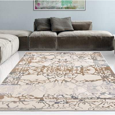 Tapis décoratif abstraite beige Delgado
