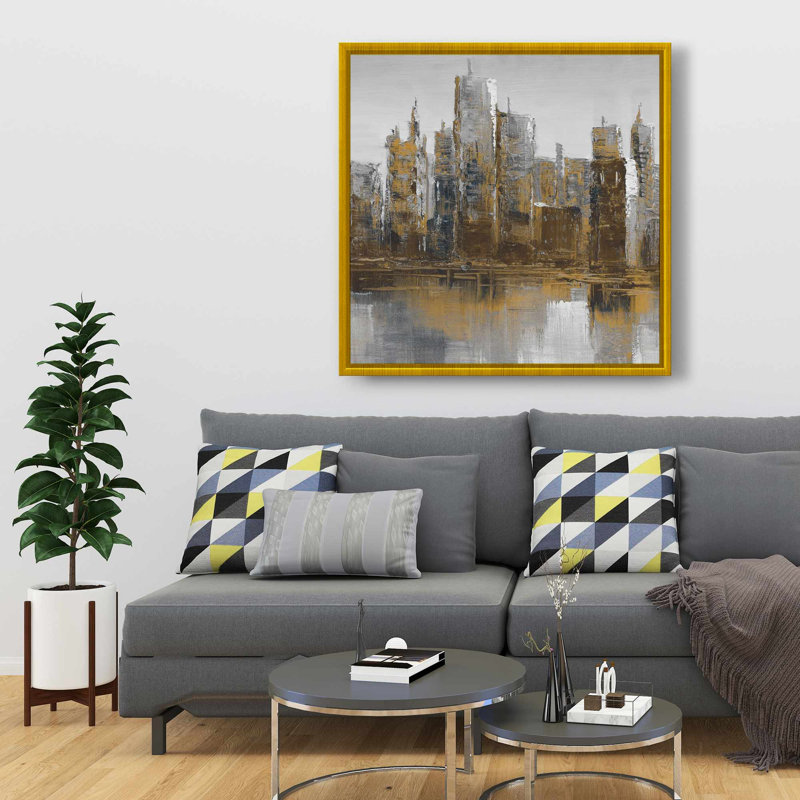 Toile encadrée brune et jaune - bâtiment brun