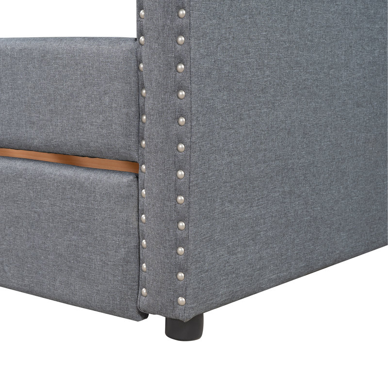 Élégant lit de jour rembourré gris avec deux tiroirs pour une base simple et stable de style maison