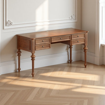 A solid wood desk with gourd shaped legs