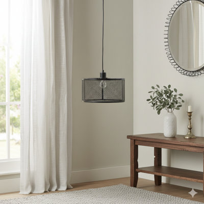 A Pendant Light With A Shade Constructed From Metal Mesh Material
