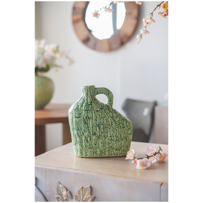 Vase asymétrique en céramique verte avec poignée et finition texturée organique