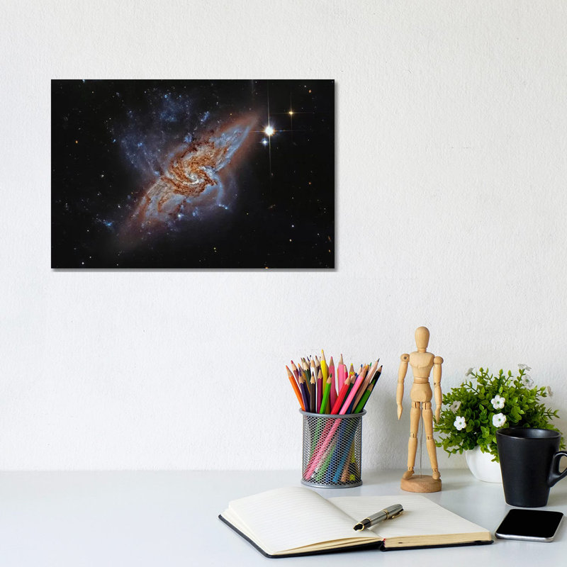 A Pair Of Overlapping Spiral Galaxies (NGC 3314) by Roberto Colombari - Wrapped Canvas Print, 20.32 cm H x 30.48 cm W