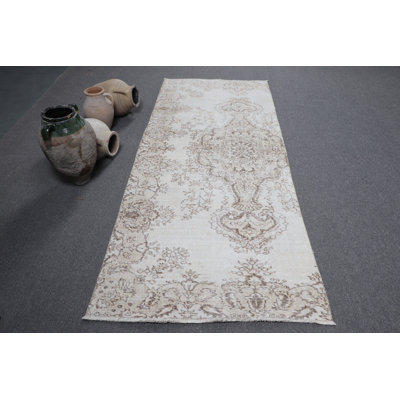 Tapis d'entrée Boho Chic avec motif médaillon beige discret de la collection de tapis turcs rétro