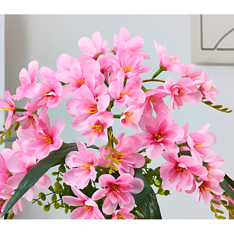 Arrangement de xiangxulan dans un vase, Rose