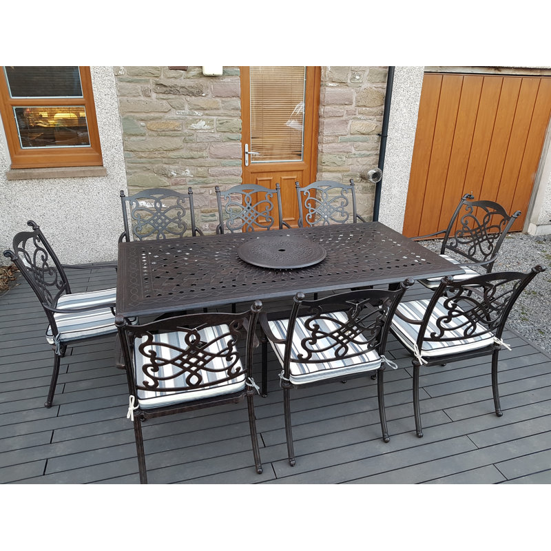Canouan 8 - Person Patio Dining Set Umbrella Hole Included Rectangular Table with Cushions Included