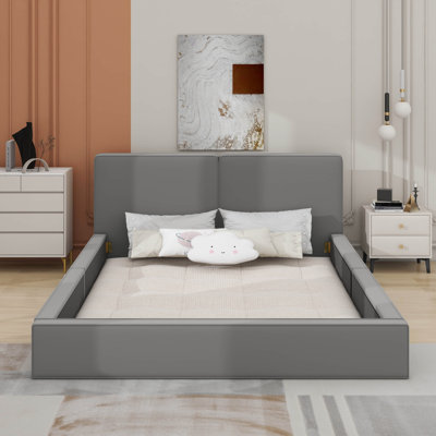 Grand lit plateforme tapissier avec tissu en velours