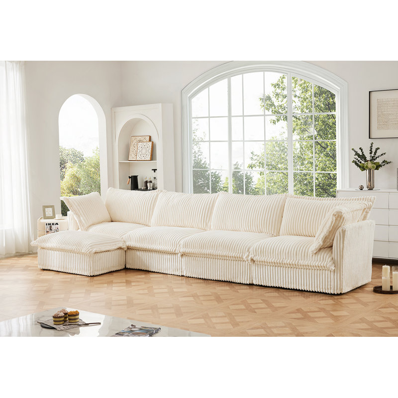 Canapé modulaire confortable en forme de L avec coussins moelleux pour le salon
