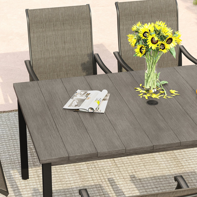 Naasir 6 - Person Steel Patio Dining Set Umbrella Hole Included Rectangular Table, Brush Wood Gray Table/Sandshell Chair