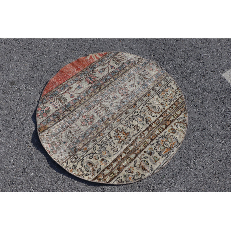 Tapis de porte rond rond de style turc avec des motifs complexes et des tons terreux pour un décor décoratif