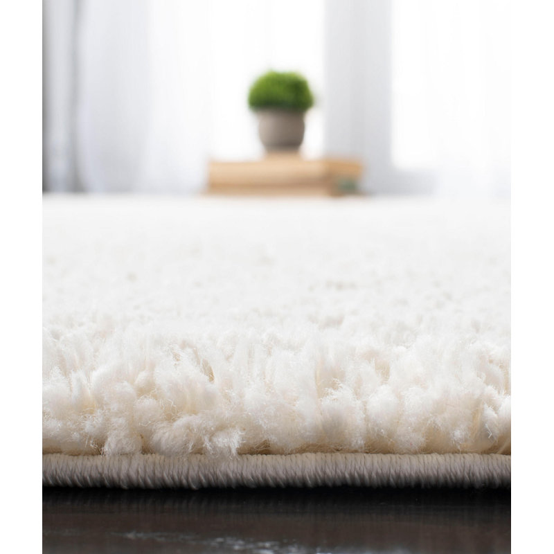 Tapis rectangulaire en polypropylène tissé à la machine de couleur unie crème, Rectangle 6 pi 7 po x 9 pi 6 po