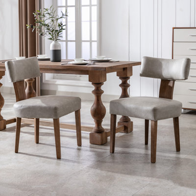 Ensemble de 2 chaises de salle à manger de style Mid-Century moderne en cuir de polyuréthane rembourré avec dossier incurvé et structure en bois franc