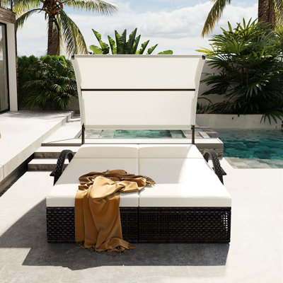 Chaise longue d'extérieur avec table d'appoint cachée et accoudoirs arqués
