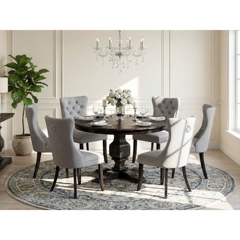 Ensemble de table de salle à manger 7 pièces composé d'une table ronde de 48 po avec piédestal et 6 chaises rembourrées en polyester gris clair, noir sablé