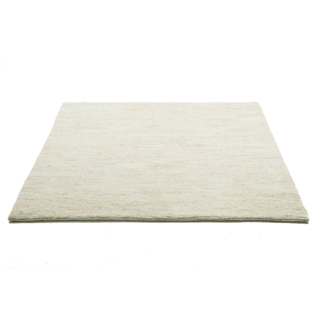 Handgefertigter Teppich Biston aus Wolle in Beige