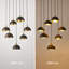 Lustre moderne à 7 lumières de 66 cm (26 po) en noir et laiton avec suspensions en forme de dôme réglables