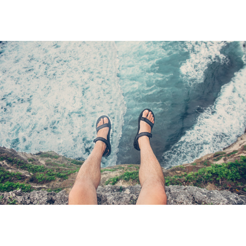Young Man Sitting On Cliff by Littlehenrabi - Wrapped Canvas Print, 30cm H x 46cm W