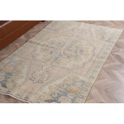Vintage Turkish Area Rug in Green for Salon Decor Featuring Natural Tribal Interior Design Elements and Pale Abstract Hand-Knotted Artistry