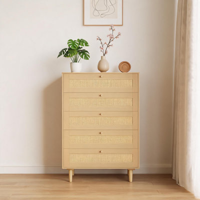 Five drawer wicker storage cabinet with metal handles and wooden legs, providing ample space for clothing storage