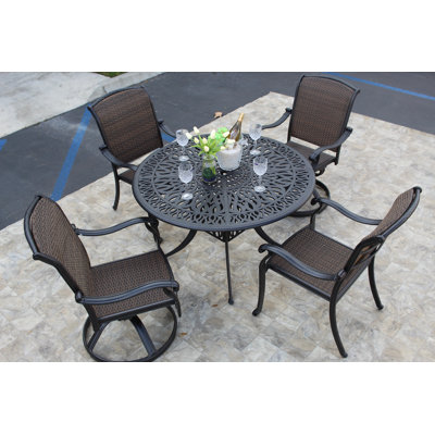 Loftus 4 - Person Patio Dining Set Umbrella Hole Included Round Table