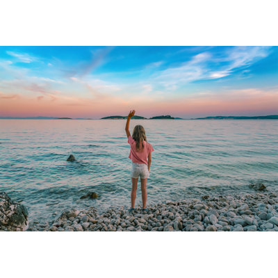 Girl Standing On Beach by Viktoriya Kraynyuk - Wrapped Canvas Print