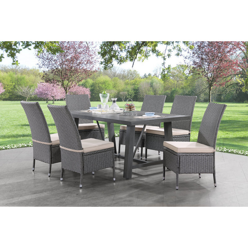 Arzan 6 - Person Wicker Patio Dining Set with Rectangular Table , Cushions Included