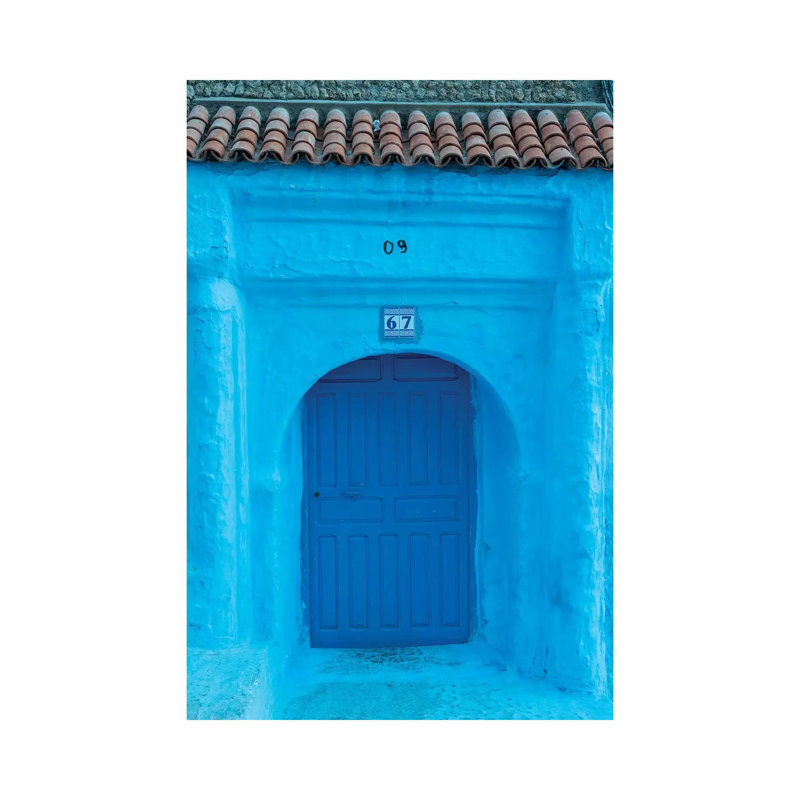 Africa, Morocco, Chefchaouen. Arch Over Wooden Door. by Jaynes Gallery - Wrapped Canvas Print