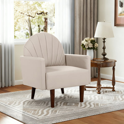 Fauteuil en forme de coquille avec revêtement en similicuir et pieds en bois