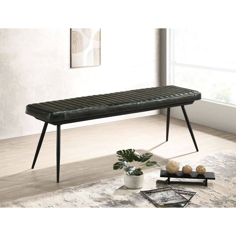 Le banc à coussin, les éléments en métal noir, ajoutent des pieds élégants et complètent la salle à manger