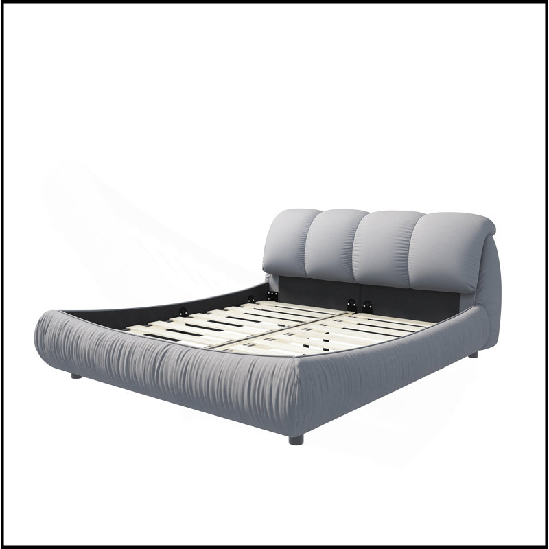 Luxueux lit plateforme tapissier avec dossier surdimensionné et structure en bois massif, offrant un confort et un style inégalés.